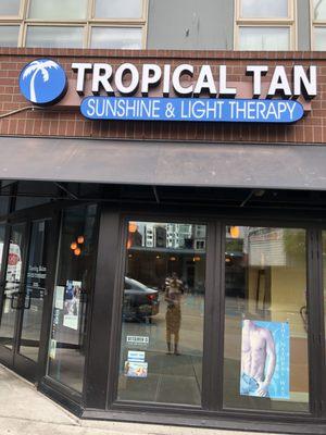 Tropical Tan of Capitol Hill storefront featuring indoor tanning, spray tanning, and redlight therapy.