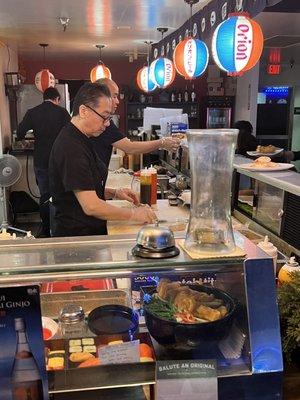 Chefs doing their thing... bar stools