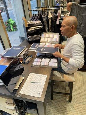 Former Governor of Mass - Deval Patrick picking out swatches for Shirts and jackets.