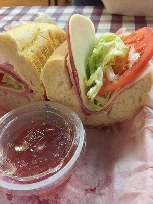 This is an Italian hoagie, one slice a piece on old roll