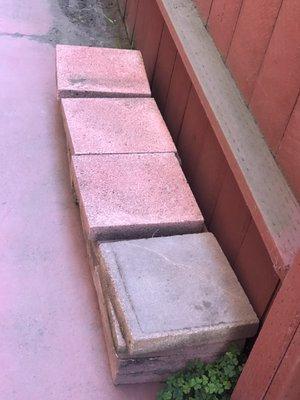 About 35 square red concrete patio stones 12" x 12" That I like to remove them from my yard