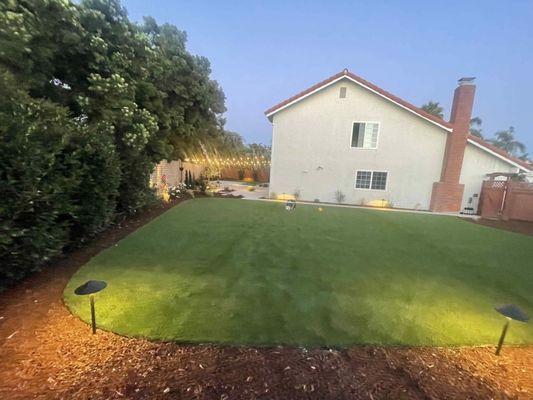 "AFTER" THE LARGE TURF INSTALL. WHAT A BEAUTY:) FIR MULCH & PREMIUM PATH LIGHTING INSTALL . THE KIDDOS WILL BE PLAYING PAST NIGHTFALL