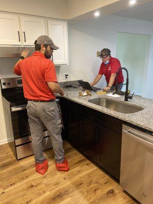 Uniformed team members caring for the seller's home.