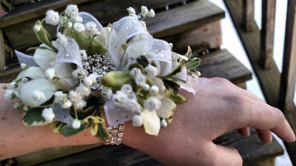 white orchid wristlet with a touch of sparkle and glitz