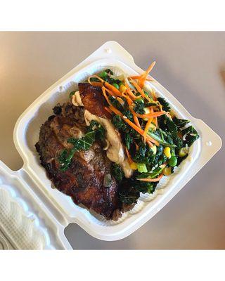 Jerk chicken with rice and peas and a side of kale.