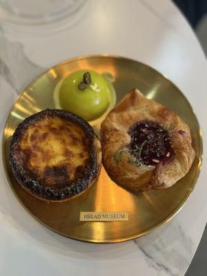 Egg tart, raspberry tart and pistachio dessert