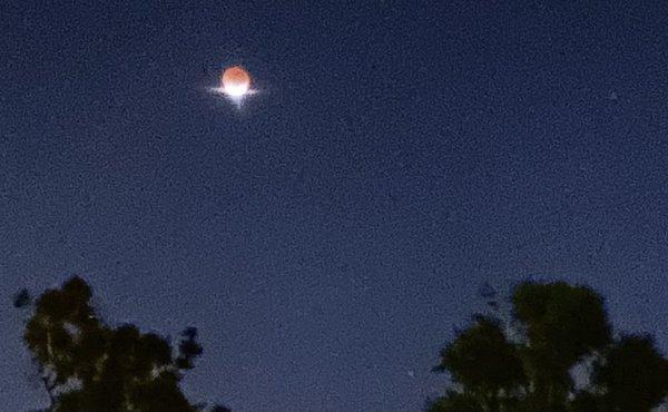 Sunlight once again reflects off of one edge of the moon as it emerges from total eclipse.