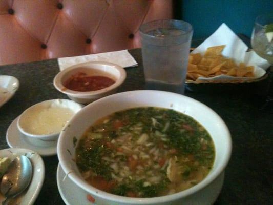 Huge bowl of chicken soup loaded w cilantro, onions, and tomatoes, plus authentic chips, salsa, and queso. Yummmm