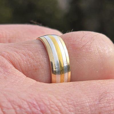 OUR WEDDING RING -- made by Daniel Weiss of 18k gold, sterling silver, and 24k gold.