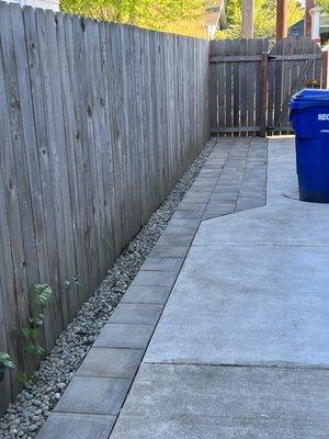 New pavers along existing concrete walkway.