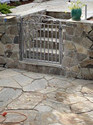 Cut a hole in our wall, built steps to an upper patio area