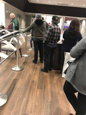 Long lines, few tellers. Service sucks