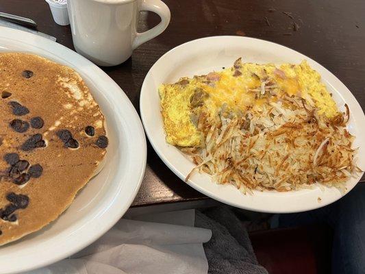 My hash browns and huge meat lovers omelette.