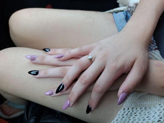 Pink and black dip acrylic nails.