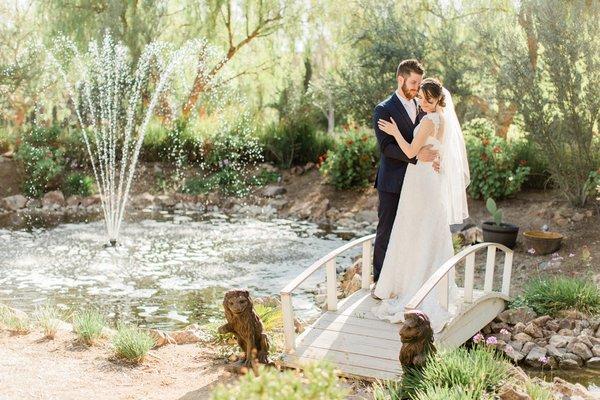 There's a small pond with a fountain, with an adorable bridge over it!