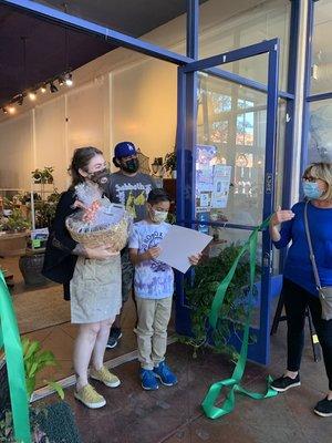 Our family at the ribbon-cutting ceremony, with the CEO of the Chamber of Commerce.