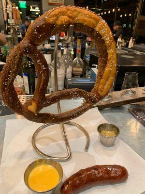 Pretzel with mustard and their specially made cheese