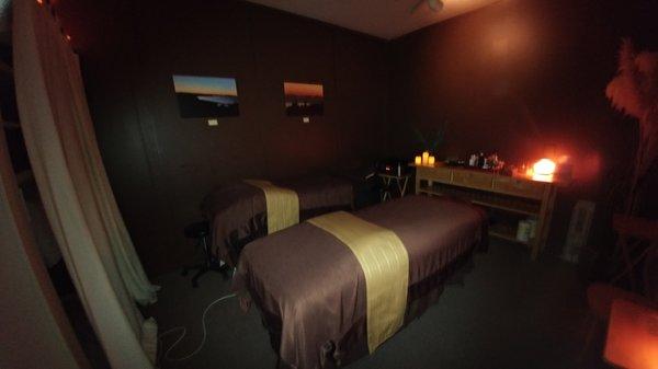 Amber room setup for a couples massage.