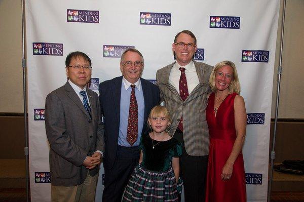 Dr. Frykman's family, Dr. Zhai and Mr. Robin Hill at the Mending Kids Gala