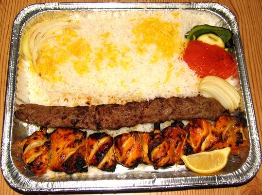 Take Out COMBO... 1 Jujeh, 1 Beef Kobideh, With rice & grilled onions, peppers & tomato. So GOOD, with the special white sauce.