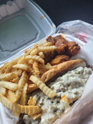 Philly cheesesteak, honey hot wings, and fries