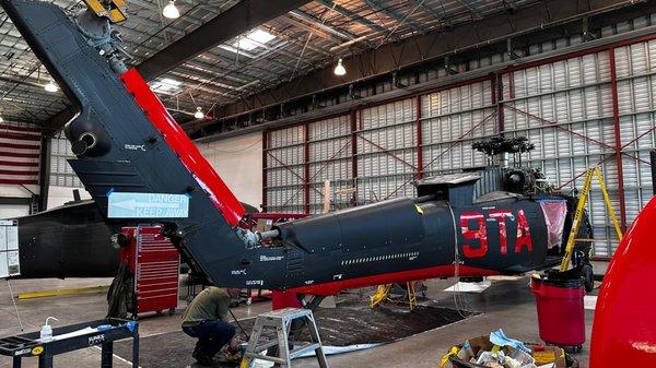 Full military helicopter vinyl wrap, black matte and red glossy. Custom decals.