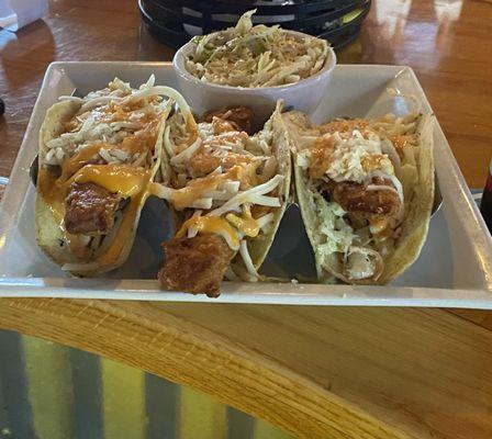 Fried fish tacos. Coleslaw, cheese and boom boom sauce on special