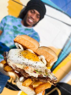 SLAW BURGER - impossible patty, fried egg, french fries, haus slaw, white american cheese, and mayo