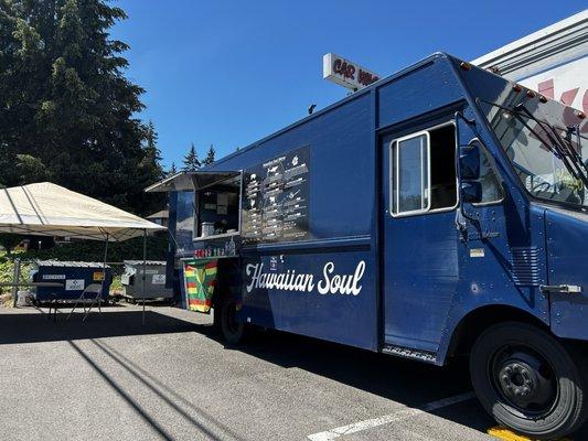 The food truck and covered outdoor seating area