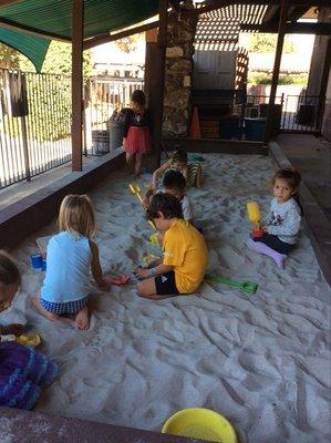 Enjoying the new enclosed sand box!