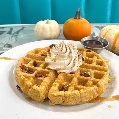 Pumpkin Spice Waffle, topped with whipped cream, caramel drizzle, pecans & pumpkin spice