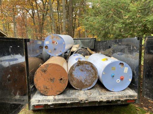 Six hot water tanks removed from the basement for a customer in Bolton, MA.