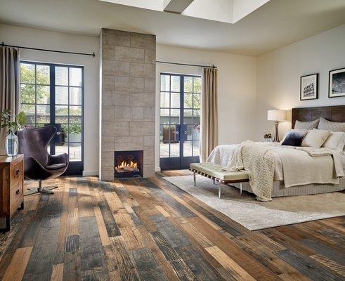 Reclaimed-look floors and concrete tile fireplace lend to a Cozy Contemporary Style!