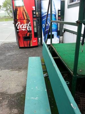 Steps to office, small bench, vending machines