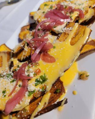 Plantain Nachos - Fried House Made Plantain Chips topped with Pico di Galo, Sliced Scallions and House Made Queso