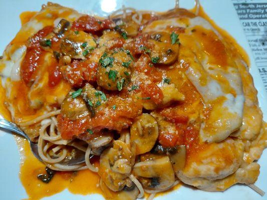 Chicken with sun-dried tomatoes and mushrooms over whole wheat spaghetti