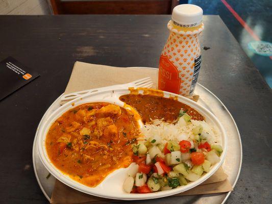 Curry with chicken and add-ons and mango lassi.