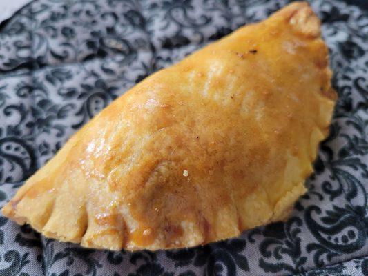 Homemade chicken empanadas.  Requires one day advance order. The delicious filling has raisins.