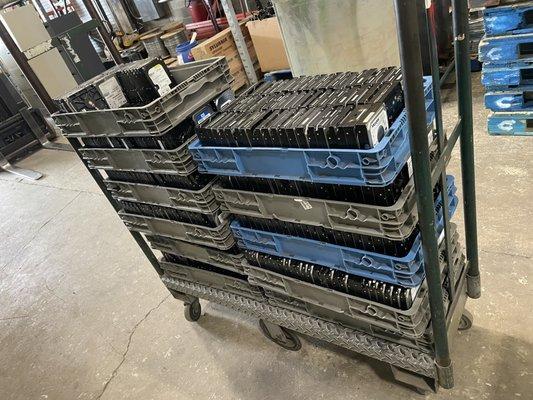 cart of hard drives being 
moved to shredder