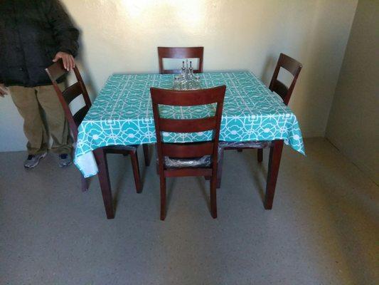 table has cover but its a nice wood we got this financed the bed and couch we paid out of pocket