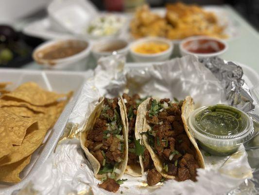 Tacos Al pastor nachos and I tried the micheladas