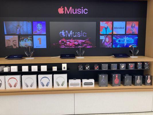 Apple Music display with AirPods Max and Beats headphones