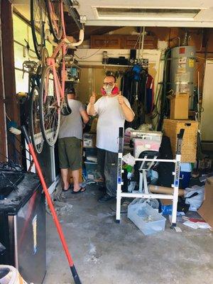 My nephew working hard cleaning out my garage