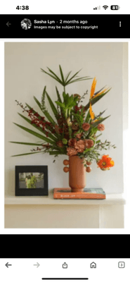 Brooklyn Blooms advertised this TROPICAL ARRANGEMENT.