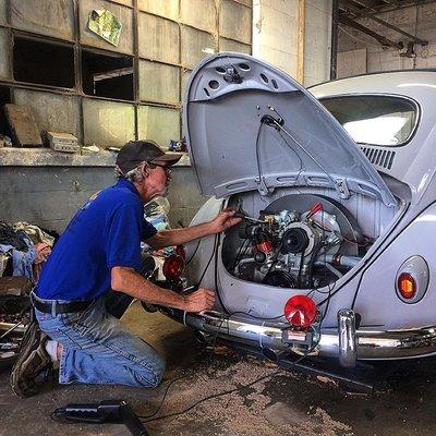 Master Mechanic Shelby working on a happy customer's VW Beetle!