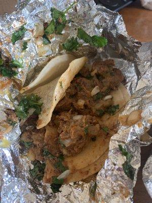 Tacos al carbon drenched in weird gravy like substance.