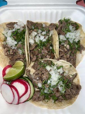 Carne Asada tacos with cucumber and radish slices