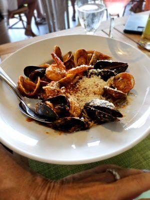 Seafood pasta. Al dente. Lightly sauced as it should be. Don't judge the cheese on my friend's pasta! If you like it that way, go for it.