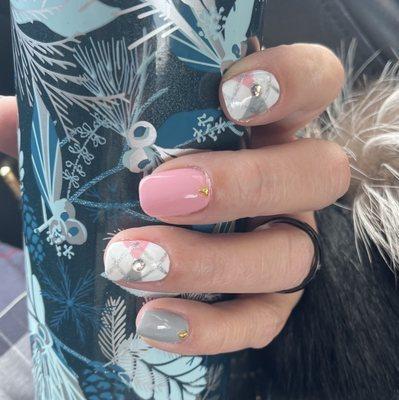 Argyle nails, pink, grey, white with gems.