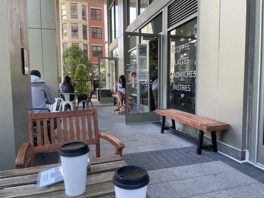 Comfy shaded patio for coffee sipping and people watching